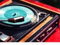 stock-photo-old-vintage-good-looking-turntable-playing-a-track-with-vinyl-203619886.jpg